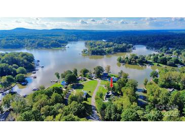 A scenic aerial view of a waterfront property with lush greenery and a peaceful lake setting at 3915 Chevlot Hills Rd, Sherrills Ford, NC 28673