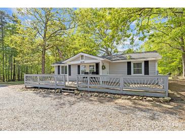 Charming single-story home featuring a spacious front porch, classic siding, and well-maintained gravel landscaping at 4436 Shiloh Unity Rd, Lancaster, SC 29720