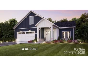 Charming single-Gathering home featuring a welcoming front porch and an attached two-car garage with beautiful landscaping at 4825 Reason Ct # 73, Harrisburg, NC 28075
