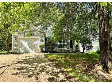 Charming single-Gathering home featuring a well-maintained front yard and a one-car garage at 8608 Warwick Crest Ln, Charlotte, NC 28215