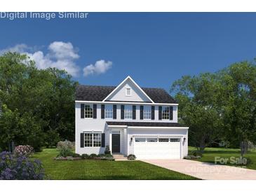 Charming two-story home with a two-car garage, manicured lawn, and classic architectural details at 498 Kenyon Dr, Denver, NC 28037