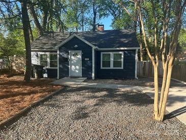 Charming blue home with a gravel front yard and inviting entrance at 1401 Anderson St, Charlotte, NC 28205