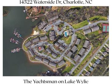 Stunning aerial view of The Yachtsman on Lake Wylie, showcasing waterfront homes, a pool, tennis courts, and boat docks at 14522 Waterside Dr, Charlotte, NC 28278