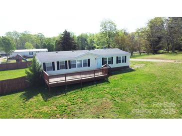 Charming single-story home with a cozy front porch and well-maintained lawn at 2055 Cauble Rd, Salisbury, NC 28144