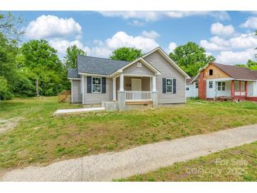 Charming single-Gathering home featuring a welcoming front porch and traditional architectural details at 340 Whitner St, Rock Hill, SC 29730