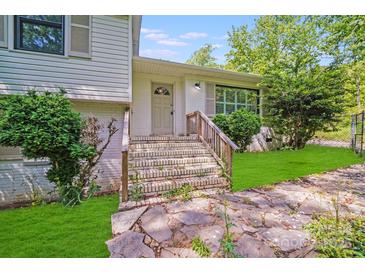 Inviting front entrance with brick steps and stone pathway leading to a charming home at 4915 Huntington Farm Rd, Catawba, SC 29704