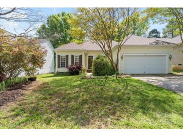 Charming single-story home with a well-maintained front lawn and attached garage at 5311 Courtfield Dr, Indian Trail, NC 28079