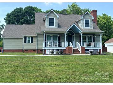 Charming home with a welcoming front porch, dormer windows, and a well-maintained lawn at 1228 Quiet Acres Rd, Rock Hill, SC 29732