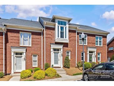 Charming brick townhome featuring a modern architectural style and well-maintained landscaping at 2638 Dilworth Heights Ln, Charlotte, NC 28209
