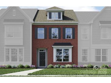 Charming brick two-story townhome with well-maintained landscaping at 4567 Potters Wheel Dr, Fort Mill, SC 29715