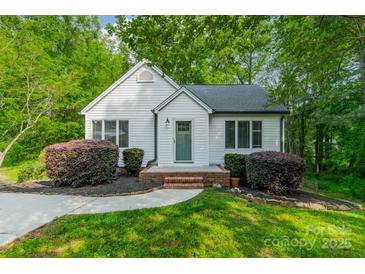 Charming, move-in ready home featuring a landscaped front yard and inviting entrance with a freshly-painted exterior at 2646 Jacobs Rd, Gastonia, NC 28054