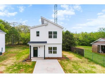 A modern two-story home with white siding, a black front door, and a minimalist design at 2043 Greenoak Dr, Shelby, NC 28152
