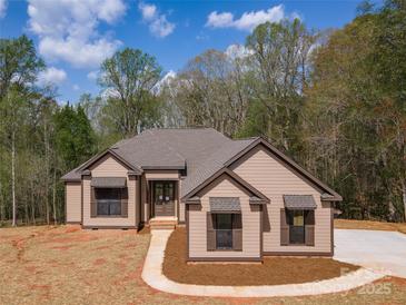 Charming single-story home with a welcoming front entrance and well-manicured lawn at 2596 Polo Ln, Maiden, NC 28650