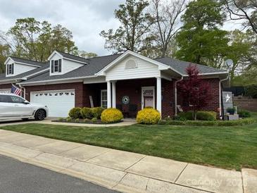 Charming single-story home with well-manicured lawn and inviting front porch at 227 Crystal Springs Ln, Shelby, NC 28150