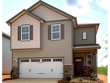 Charming two-story home with a two car garage and a welcoming covered porch at 278 Bezelle Ave, York, SC 29745
