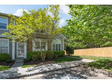 Charming townhome with mature landscaping, stone accents, and a welcoming front entrance at 643 Brickdust Ct, Fort Mill, SC 29708