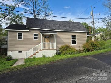 Charming single-story home with neutral siding, new roof, and inviting front porch at 132 Loomis St, Chester, SC 29706
