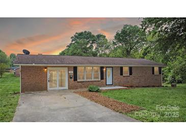 Charming brick home with well-manicured lawn and inviting entrance at sunset at 1500 19Th Avenue Ne Pl, Hickory, NC 28601