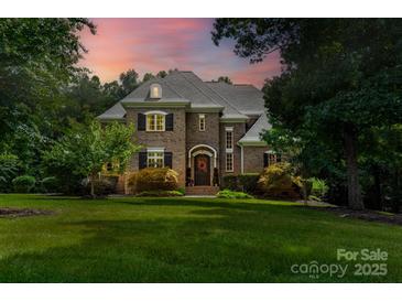Beautiful brick home features a well-manicured lawn and elegant architectural details at 5983 Rolling Ridge Dr # 33, Kannapolis, NC 28081