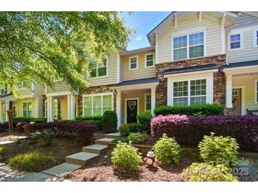 Charming townhome with stone accents, manicured landscaping, and a welcoming front entrance at 8504 Sunset Hill Rd, Waxhaw, NC 28173