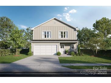 Charming two-story home features a two-car garage and a beautifully landscaped front yard, perfect for a Gathering at Lot 1 Spruce St, Kannapolis, NC 28083
