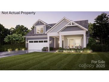 Charming two-story home featuring a manicured lawn, a two car garage and a welcoming front porch with chairs at 3 Five Creek Rd # 3, Charlotte, NC 28213