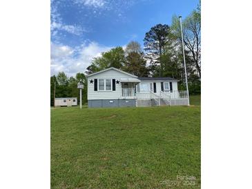 Charming single-story home with a covered porch, black shutters, and a large front yard at 3514 Valley Dr, Chester, SC 29706