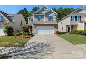 Charming two-story home featuring a two-car garage, inviting curb appeal, and well-maintained landscaping at 78090 Rillstone Dr, Lancaster, SC 29720
