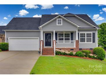 Charming single Gathering home with a manicured lawn, gray siding and attached garage at 835 Holdcroft Ln, Rock Hill, SC 29730