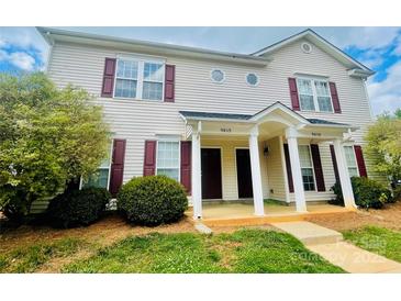 Inviting townhouse with a charming entrance and manicured landscaping at 9615 Littleleaf Dr, Charlotte, NC 28215