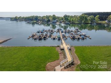 An aerial view of the lake, walking path, and boat slips at the condo community at 18700 Nautical Dr # 101, Cornelius, NC 28031