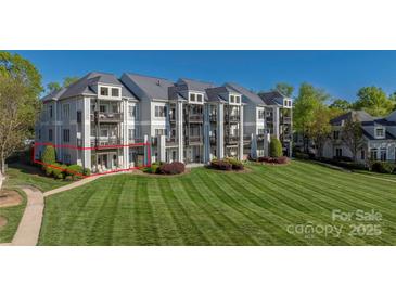 Multi-story condo features a large lawn with mature landscaping and private balconies in a desirable community setting at 18700 Nautical Dr # 101, Cornelius, NC 28031