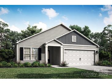Charming one-story home featuring gray siding, a covered entrance, and a well-maintained lawn at 3435 Saddlebred Dr, Gastonia, NC 28052