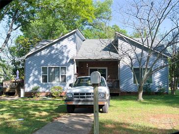 Charming single-Gathering home with light blue siding, brick accents, and a well-manicured front yard at 441 Kimbrook Ct, Rock Hill, SC 29730