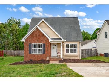 Charming home featuring a brick facade, complemented by a well-manicured lawn and inviting front entrance at 126 Newsome Rd, Salisbury, NC 28146