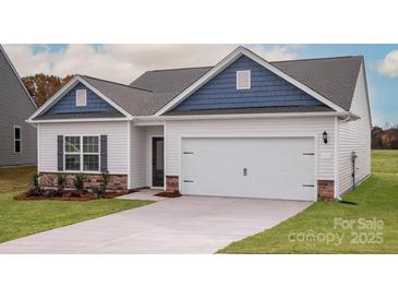 Charming single-Gathering home featuring a two-car garage and manicured lawn at 3346 Strong Box Ln, Gastonia, NC 28052