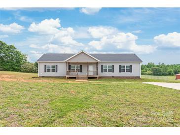 Charming ranch-style home with gray siding, black shutters, and a cozy front porch at 3648 Plainfield Dr, Shelby, NC 28150