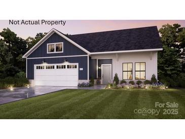 Charming craftsman style home with a two-car garage, lush lawn, and beautifully landscaped front yard at 4831 Reason Ct # 72, Harrisburg, NC 28075