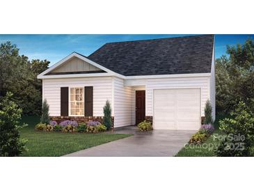Charming single-story home boasts a well-manicured lawn, stone accents, and a convenient attached garage at 584 N Sparkleberry St, Chester, SC 29706