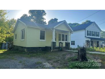 Charming single-Gathering home featuring a covered front porch and quaint architectural details at 116 Morning Glory Ave, Belmont, NC 28012