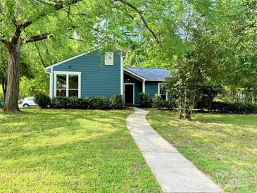 Charming one-story home with a well-maintained lawn and inviting walkway at 11824 Larkridge Ct, Charlotte, NC 28226