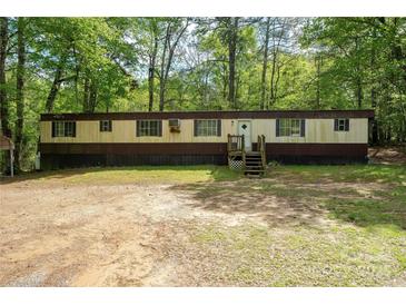 Spacious one-story home with a cozy front porch and large yard at 2275 Brown Creek Church Rd, Wadesboro, NC 28170