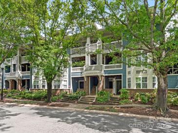 Attractive condo building featuring balconies, manicured landscaping, and vibrant curb appeal at 415 Mather Green Ave # I, Charlotte, NC 28203