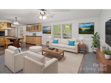 Bright living room featuring modern furniture, art, and ample natural light at 4757 Mountain View Ln, Maiden, NC 28650