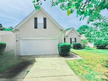 Charming one-story home with a well-maintained lawn and a two-car garage at 9109 Foggy Meadow Rd, Charlotte, NC 28269