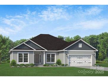 Charming single-story home featuring a well-maintained lawn, covered entrance, and attached two-car garage at 1050 Gardenia Dr # 3, Mt Ulla, NC 28125