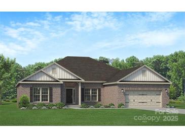 Charming brick home with a well-maintained lawn and attached two-car garage at 1469 Mocksville Hwy # 21, Statesville, NC 28625