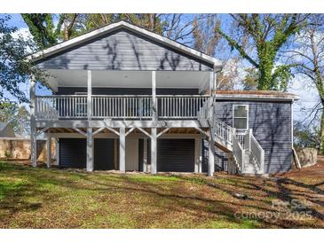 Charming gray two-story home with inviting front porch and visible substructure at 2403 Mary Ave, Gastonia, NC 28052