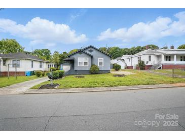 Charming single-story home featuring a well-manicured lawn and classic curb appeal at 313 Mayflower Ave, Cramerton, NC 28032