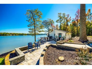Lakeside patio with seating and panoramic views of the water, perfect for relaxing at 6788 Bucleigh Rd, Clover, SC 29710